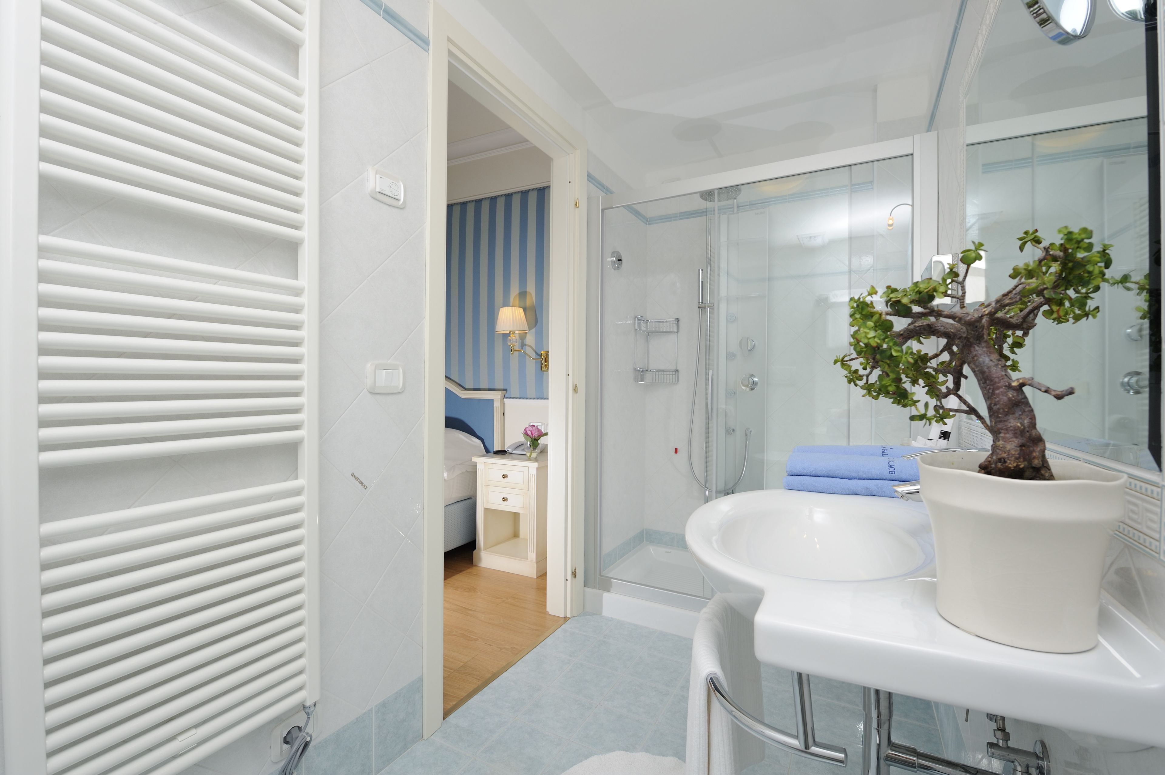 rainfall showerhead, designer toiletries, hair dryer, bathrobes