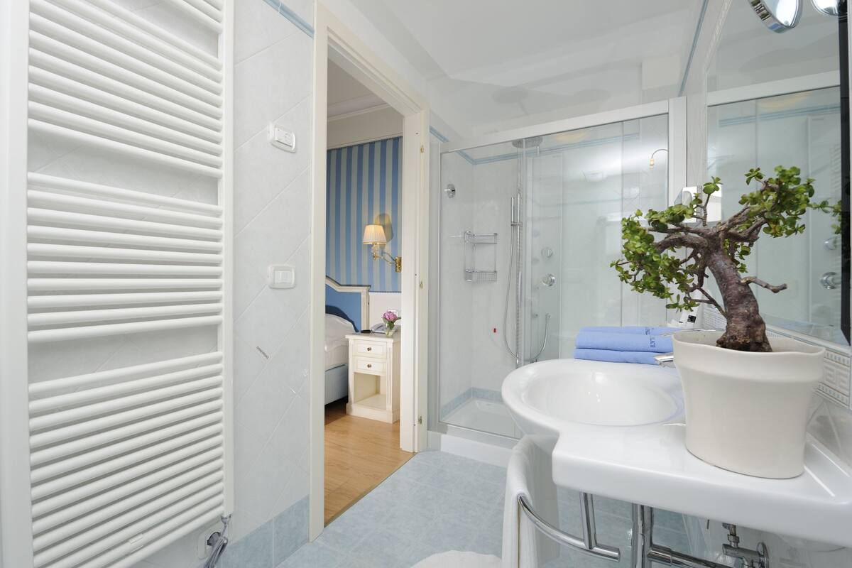 rainfall showerhead, designer toiletries, hair dryer, bathrobes