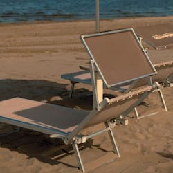 On the beach, white sand, sun-loungers, beach umbrellas