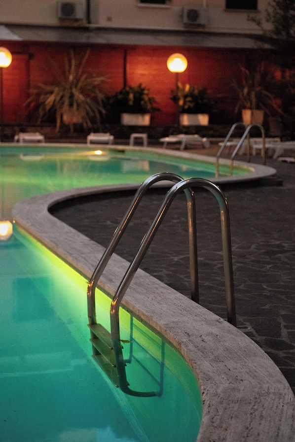 Seasonal outdoor pool, open 9 AM to 7 PM, sun loungers
