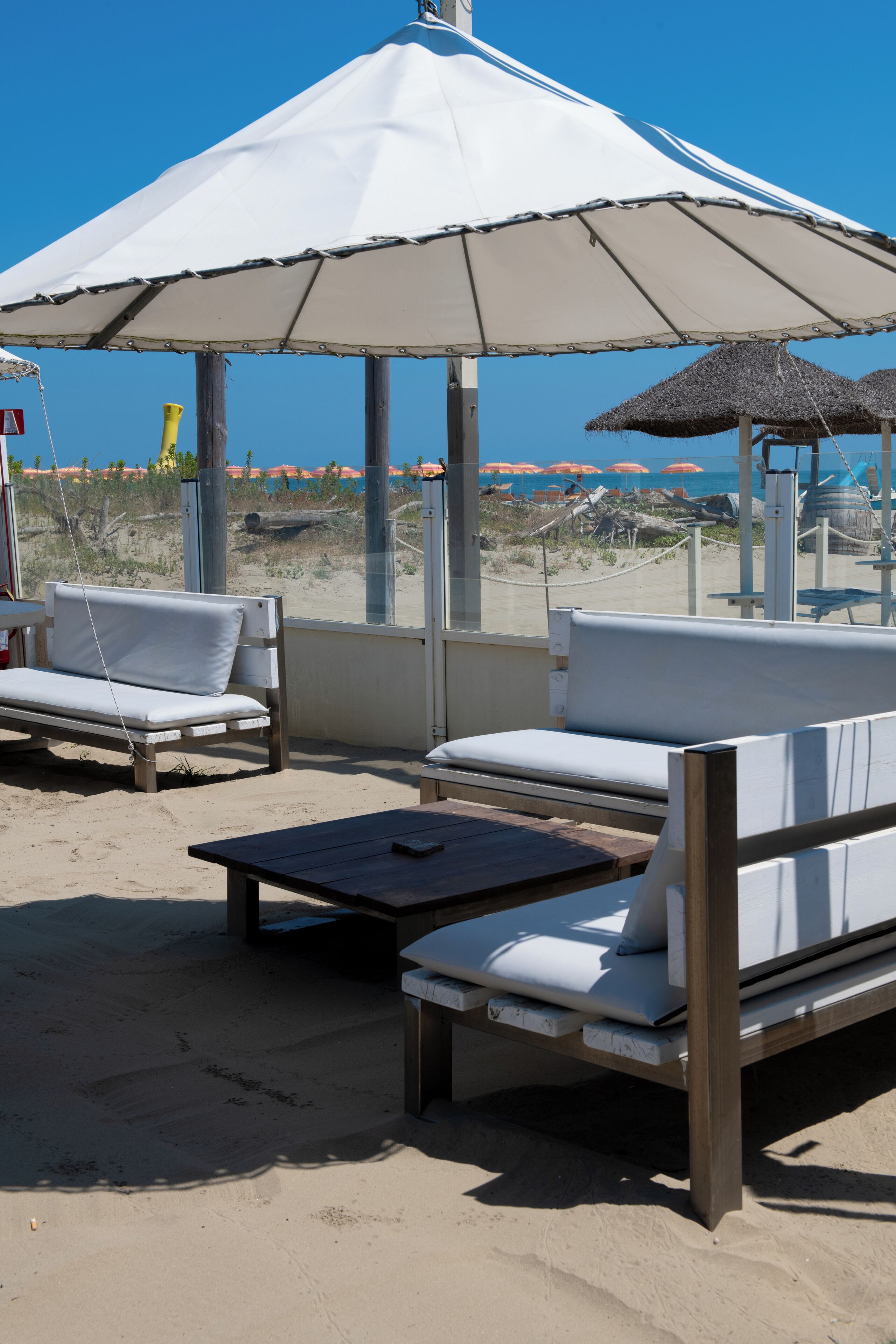 On the beach, white sand, sun-loungers, beach umbrellas