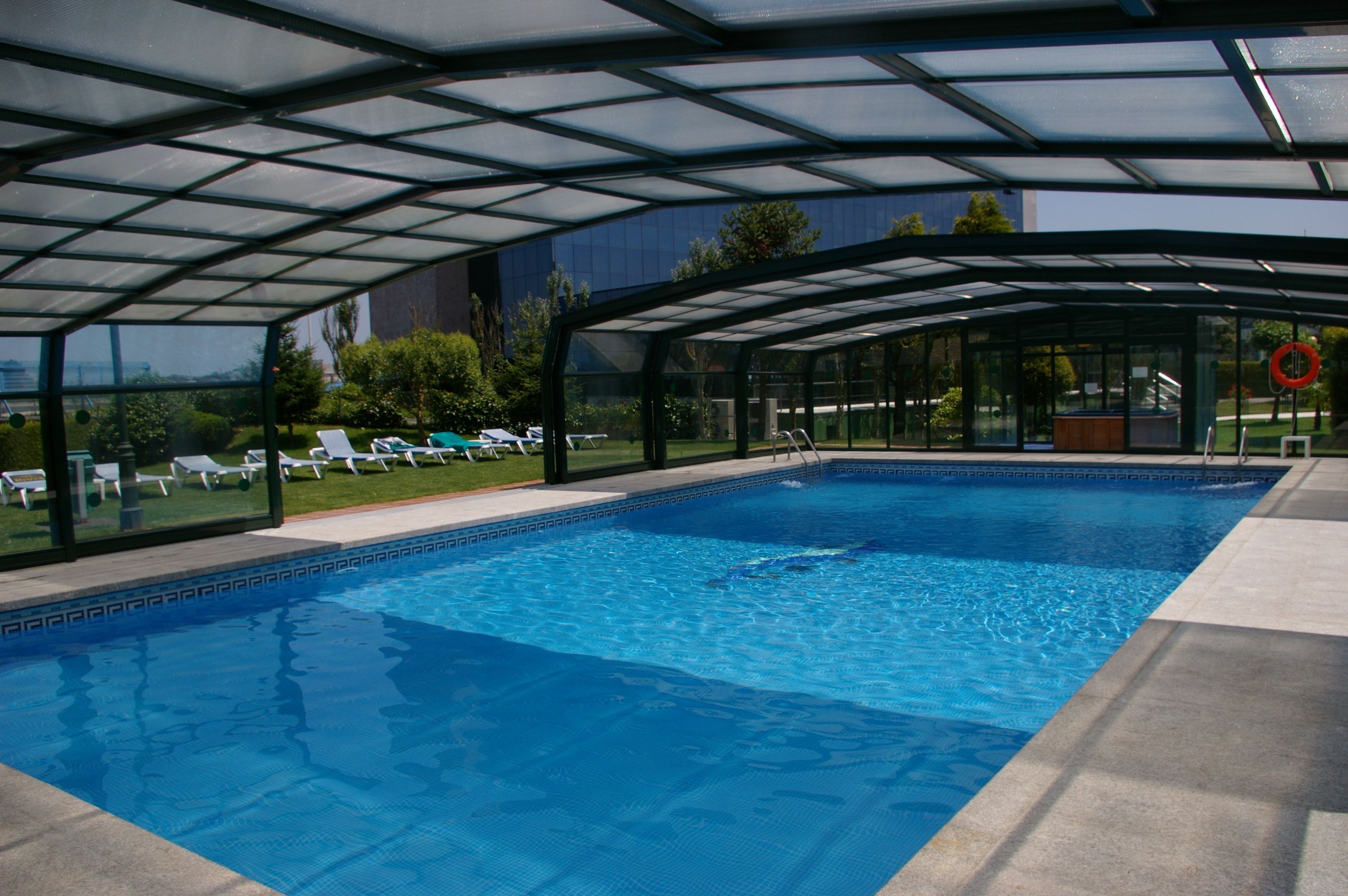 indoor pool, outdoor pool, open 9:00 am to 9:00 pm, pool loungers