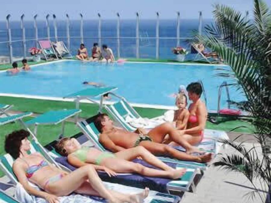 Seasonal outdoor pool, open 8:30 AM to 7:00 PM, pool loungers