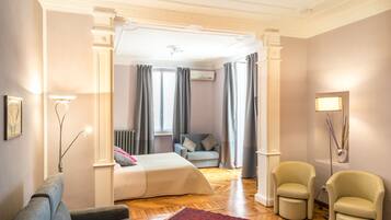 Comfort Quadruple Room | Minibar, in-room safe, desk, blackout drapes