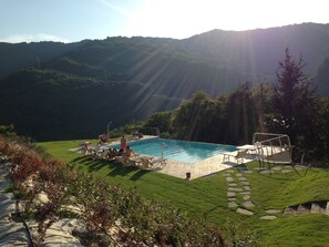 Outdoor pool, an infinity pool, pool loungers
