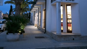 A hotel named "Sabbia D'Oro" with a balcony and a sign indicating it is a hotel. - Hotel Sabbia D'Oro (San Vito Lo Capo)