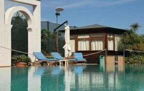 Seasonal outdoor pool, pool loungers