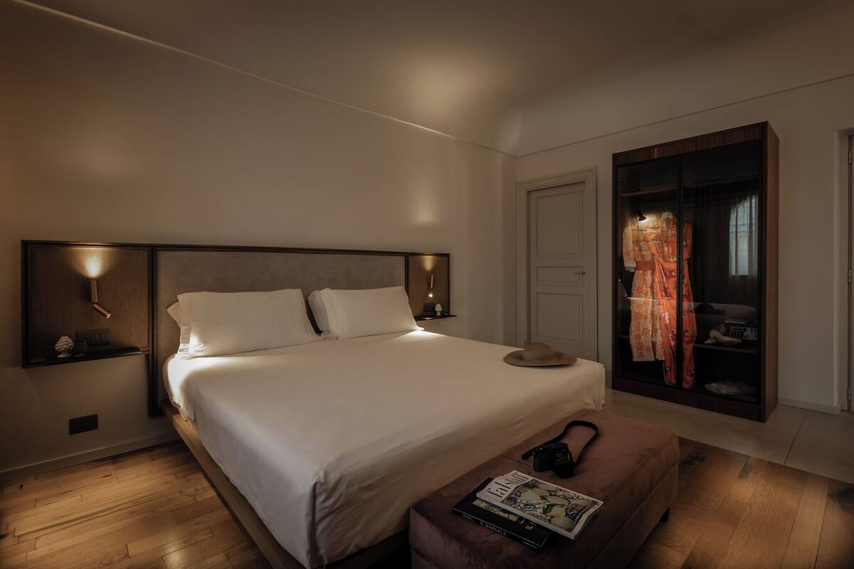 Deluxe Suite, 1 King Bed, Sauna, Courtyard View | Down comforters, minibar, in-room safe, desk