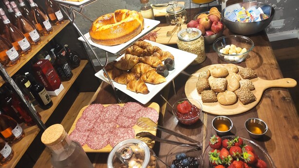 A breakfast buffet with various food items, including pastries, fruits, and condiments. - Basilio 55 Rome (Rome)