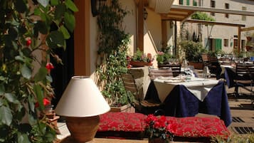 Breakfast, lunch, dinner served; local cuisine, al fresco dining 