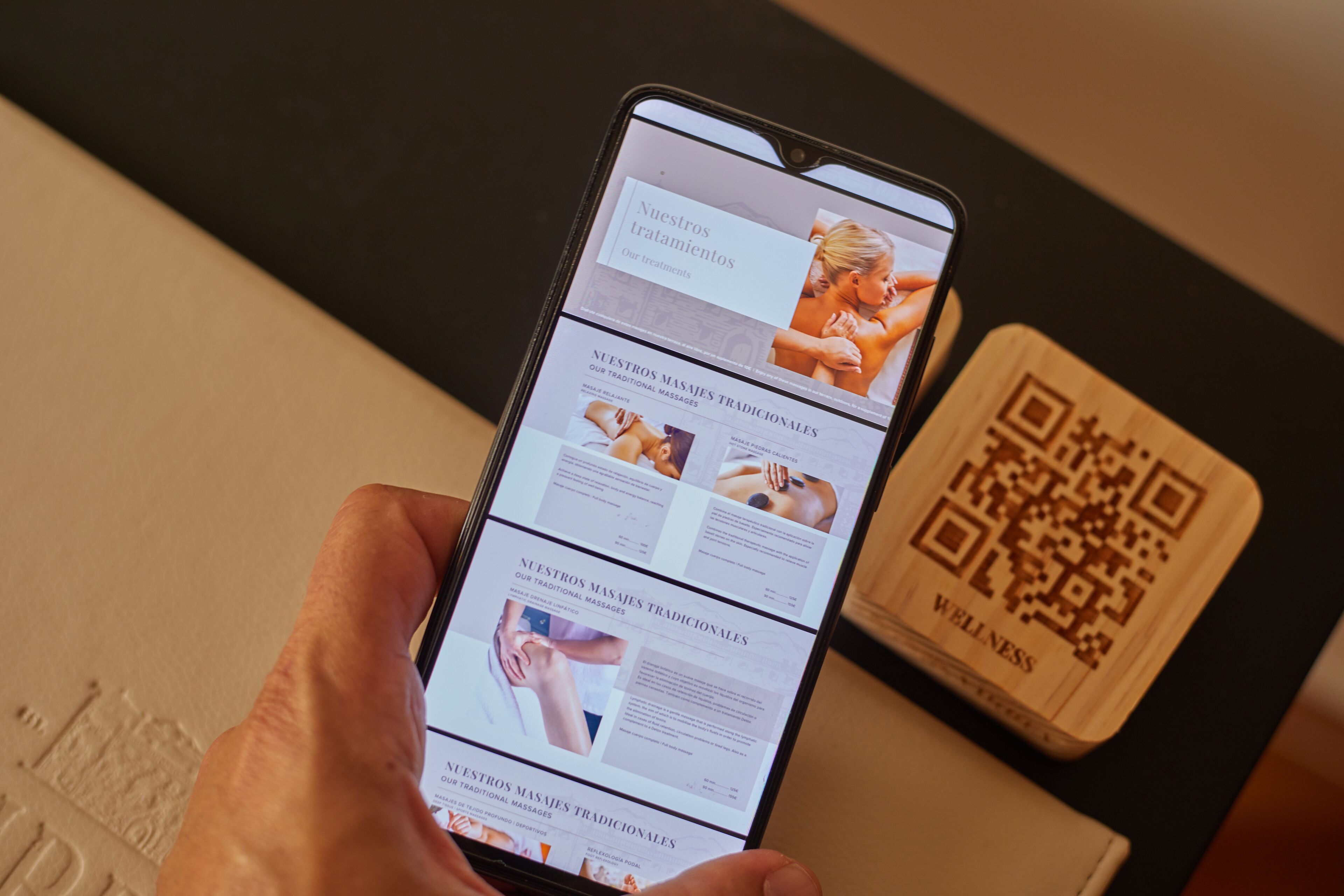 A smartphone displaying a webpage with information about traditional massages.