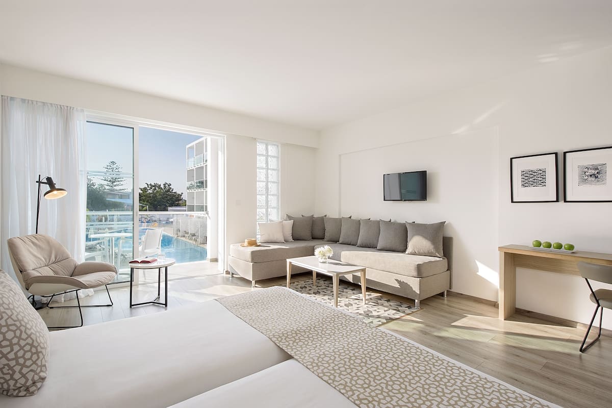 superior room, pool view | living area | flat-screen tv, ping pong