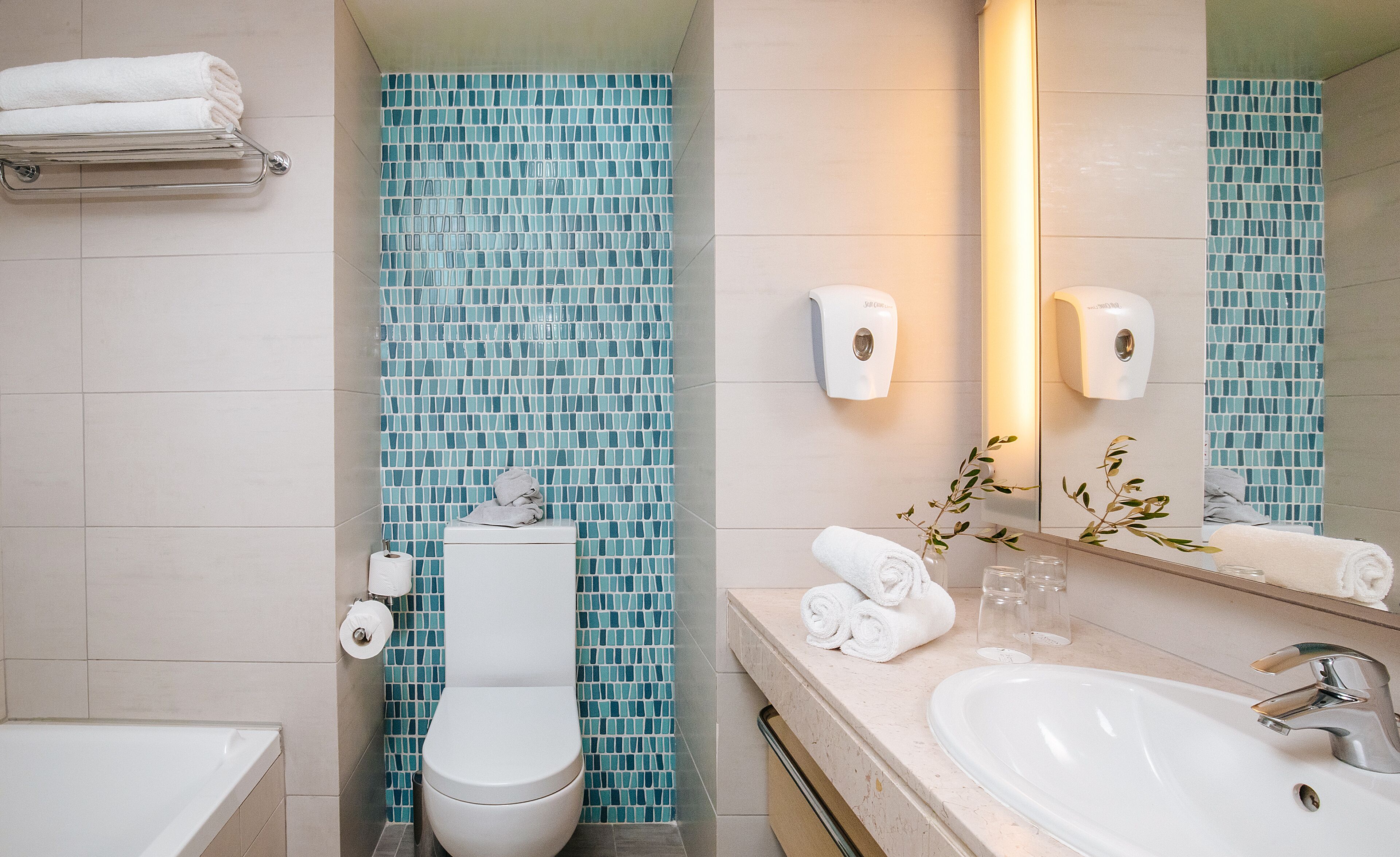 eco-friendly toiletries, hair dryer, towels, toilet paper