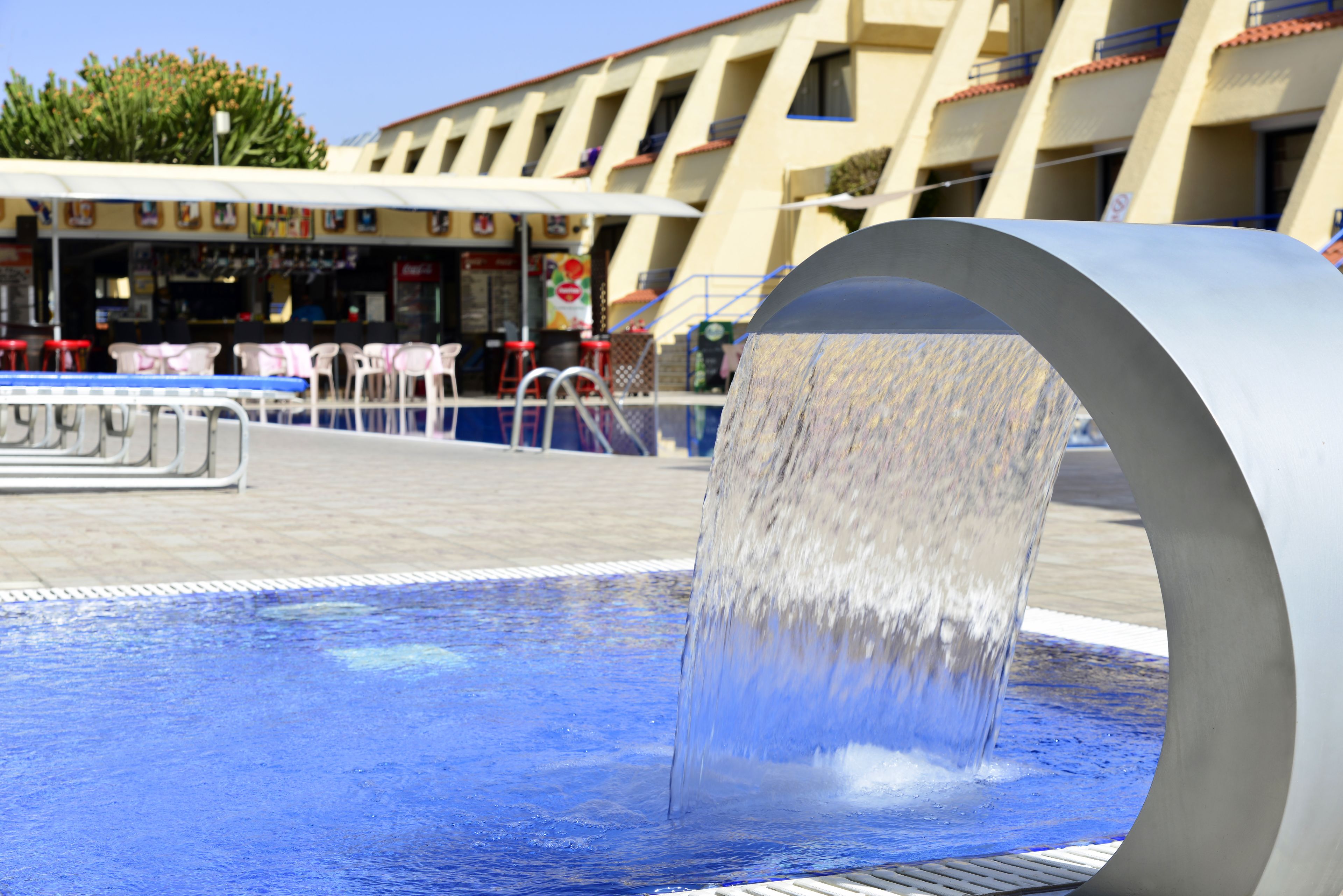 Seasonal outdoor pool, pool loungers