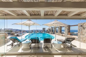 Seasonal outdoor pool, open 9:00 AM to 8:00 PM, pool umbrellas