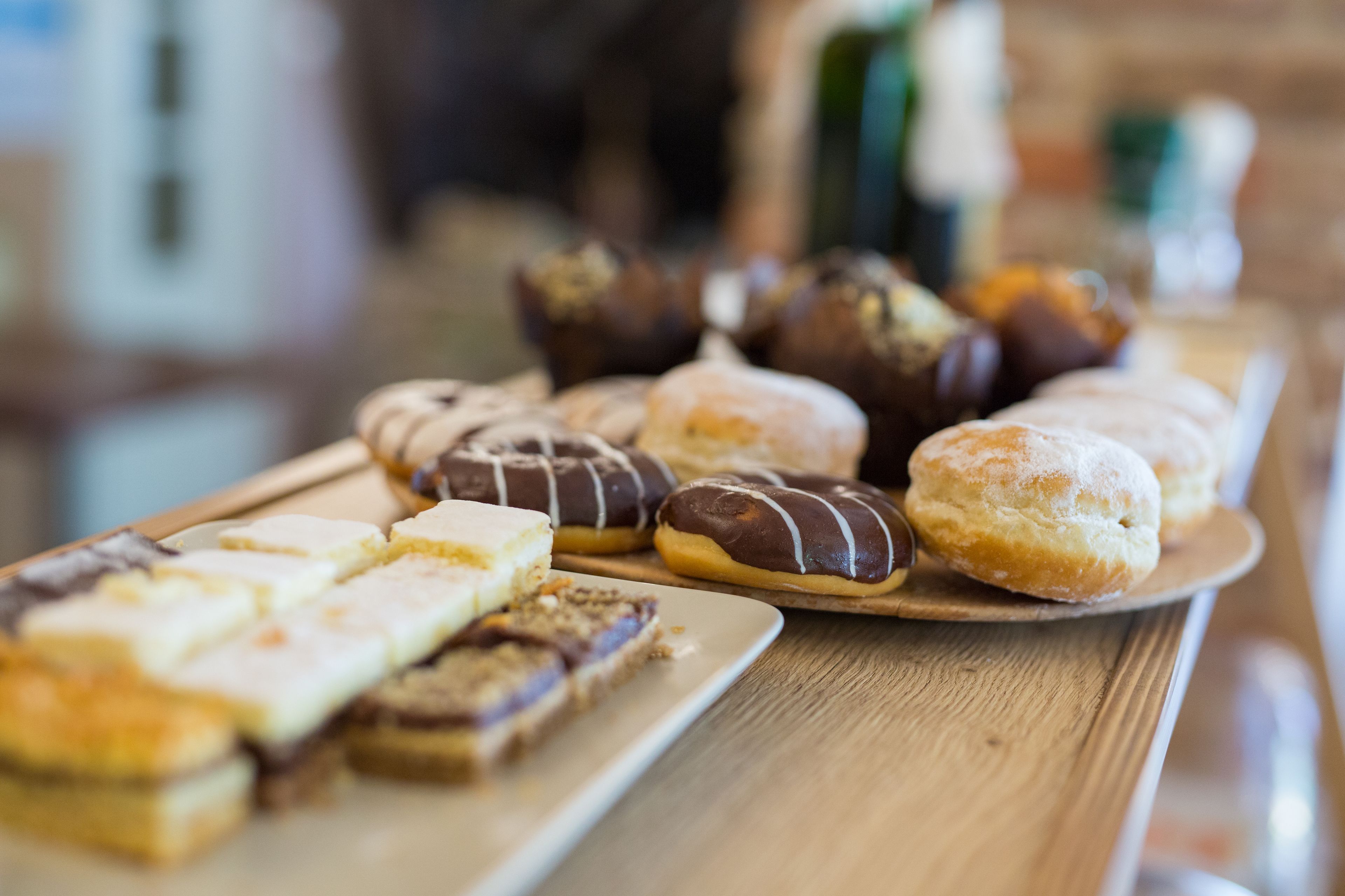 A variety of pastries on a wooden board.