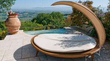 Outdoor pool, open 9:00 AM to 7 PM, pool umbrellas, sun loungers