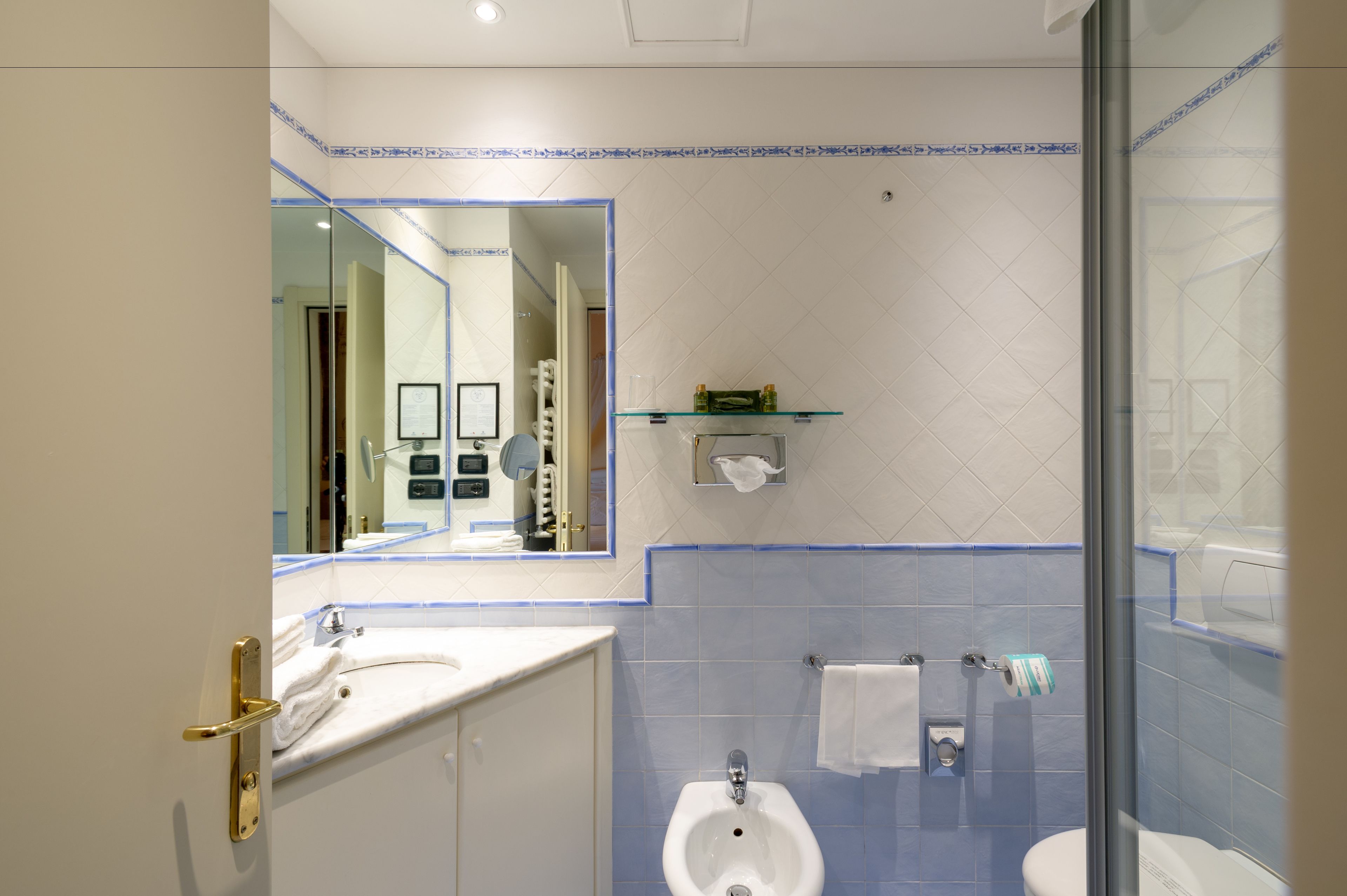 superior triple room | bathroom | shower, free toiletries, hair dryer, towels