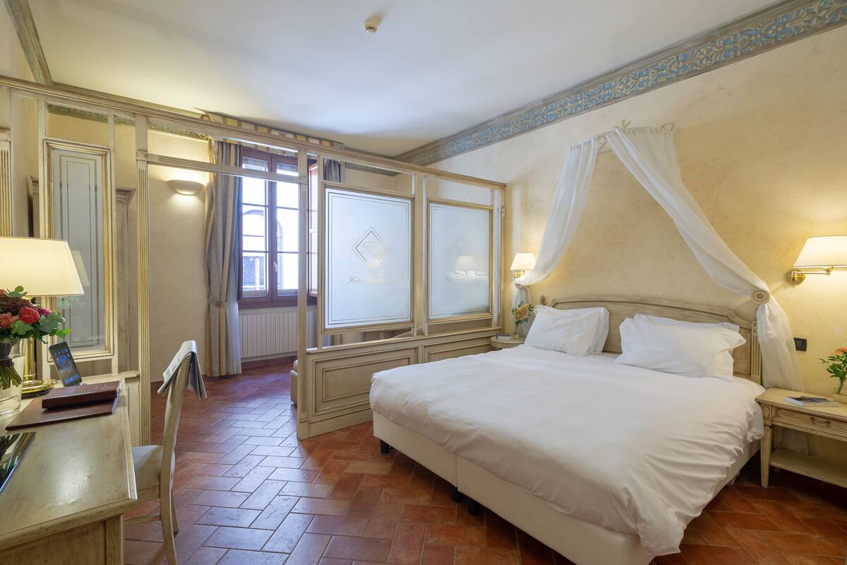 superior quadruple room | down duvets, minibar, in-room safe, desk