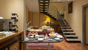 A breakfast buffet with various food items and a coffee station. - Davanzati (Florence)