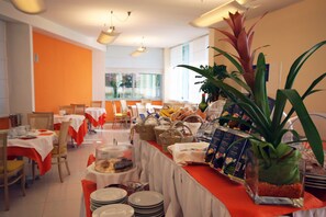 Enjoy a communal dining experience with comfortable seating and a variety of food options.