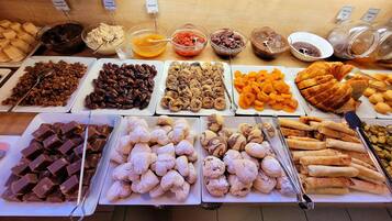 A variety of pastries and spreads on display at a bakery or cafe.