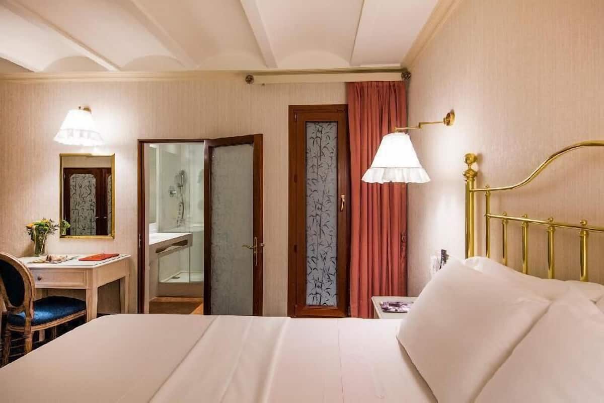 Premium bedding, down comforters, Select Comfort beds, in-room safe