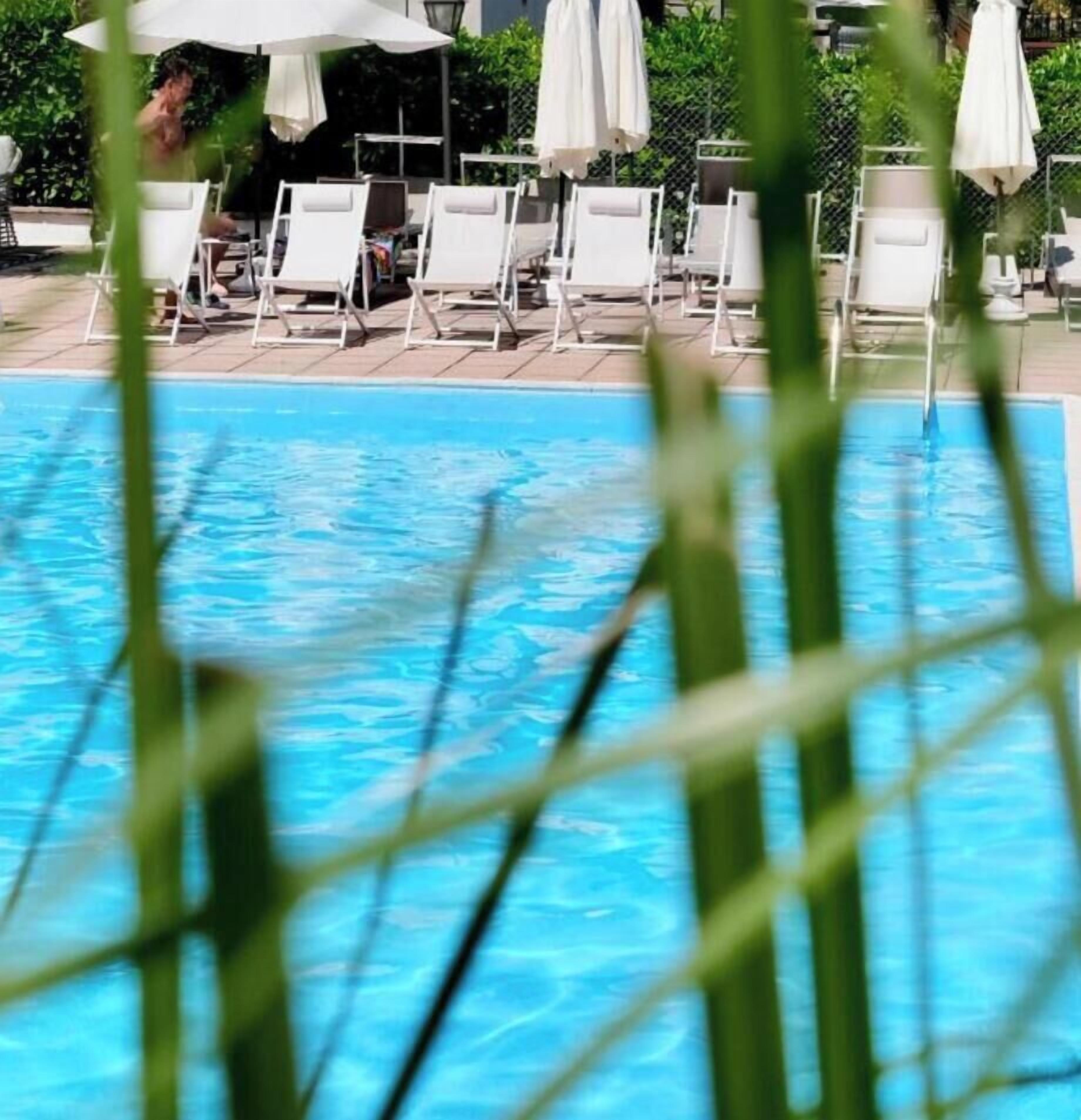Outdoor pool, open 7:00 AM to 10:30 PM, pool umbrellas, pool loungers