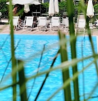 Outdoor pool, open 7:00 AM to 10:30 PM, pool umbrellas, sun loungers