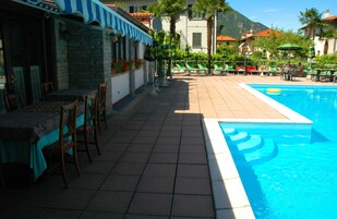 Outdoor pool, open 7:00 AM to 10:30 PM, pool umbrellas, pool loungers