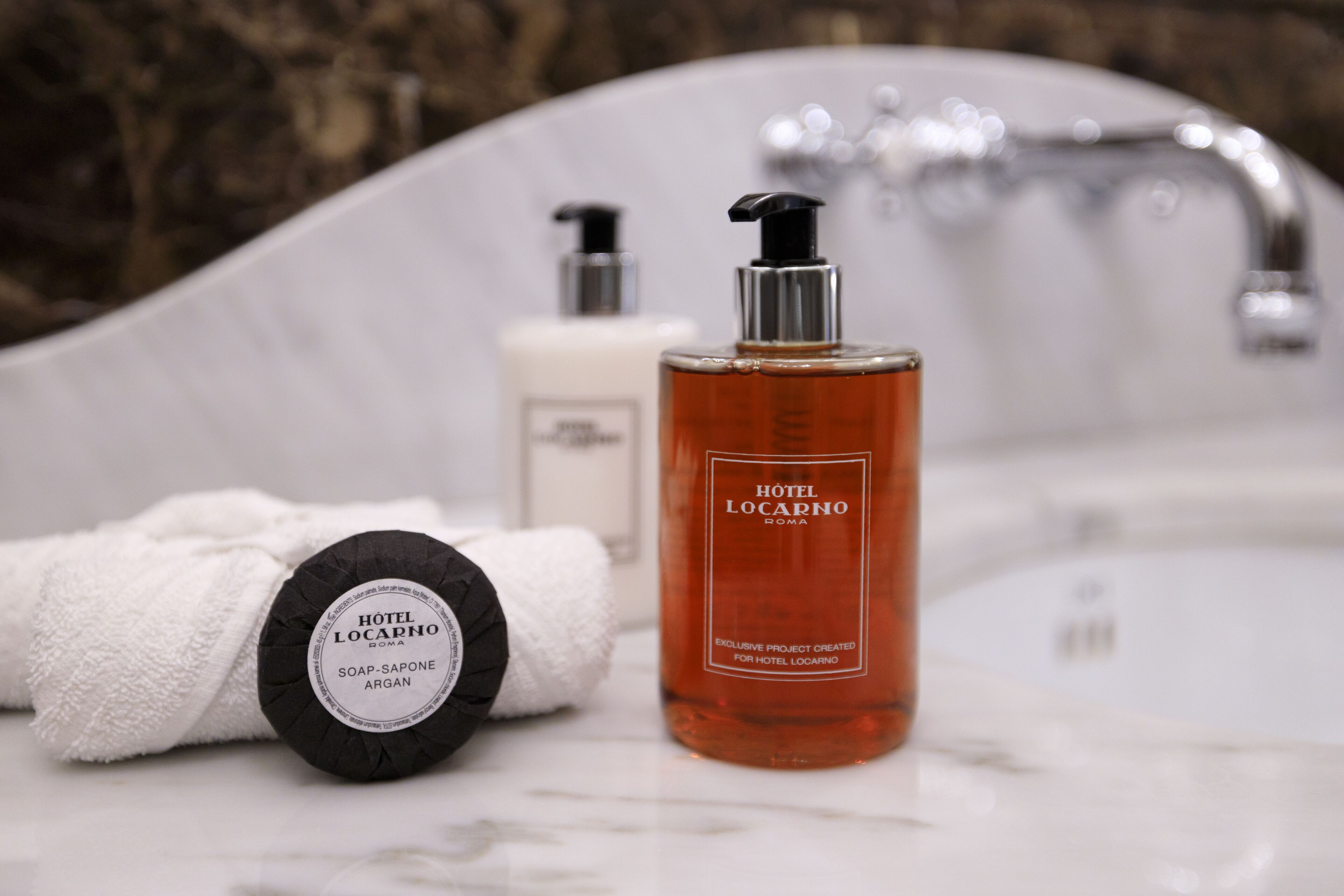 designer toiletries, hair dryer, bathrobes, slippers