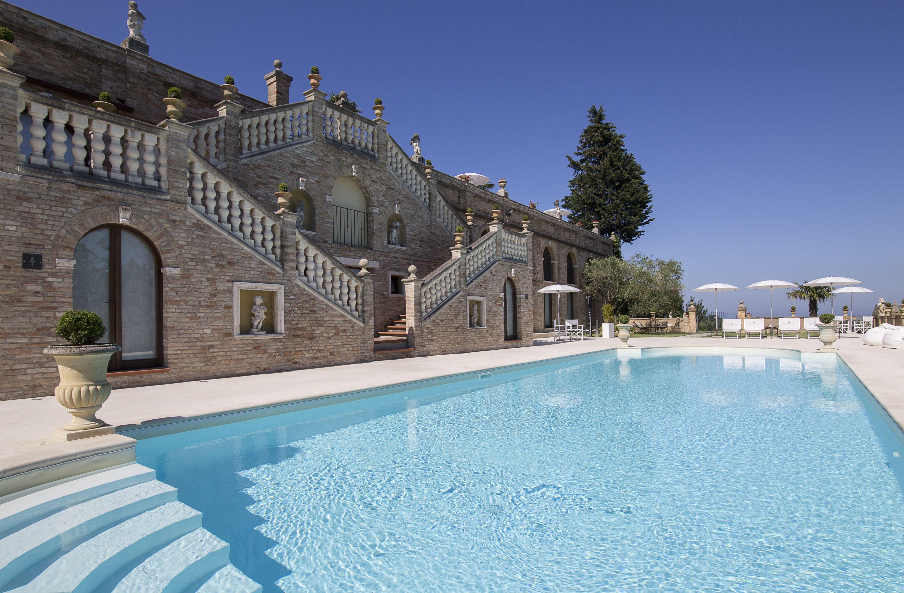 seasonal outdoor pool, open 9:00 am to 9:00 pm, pool umbrellas