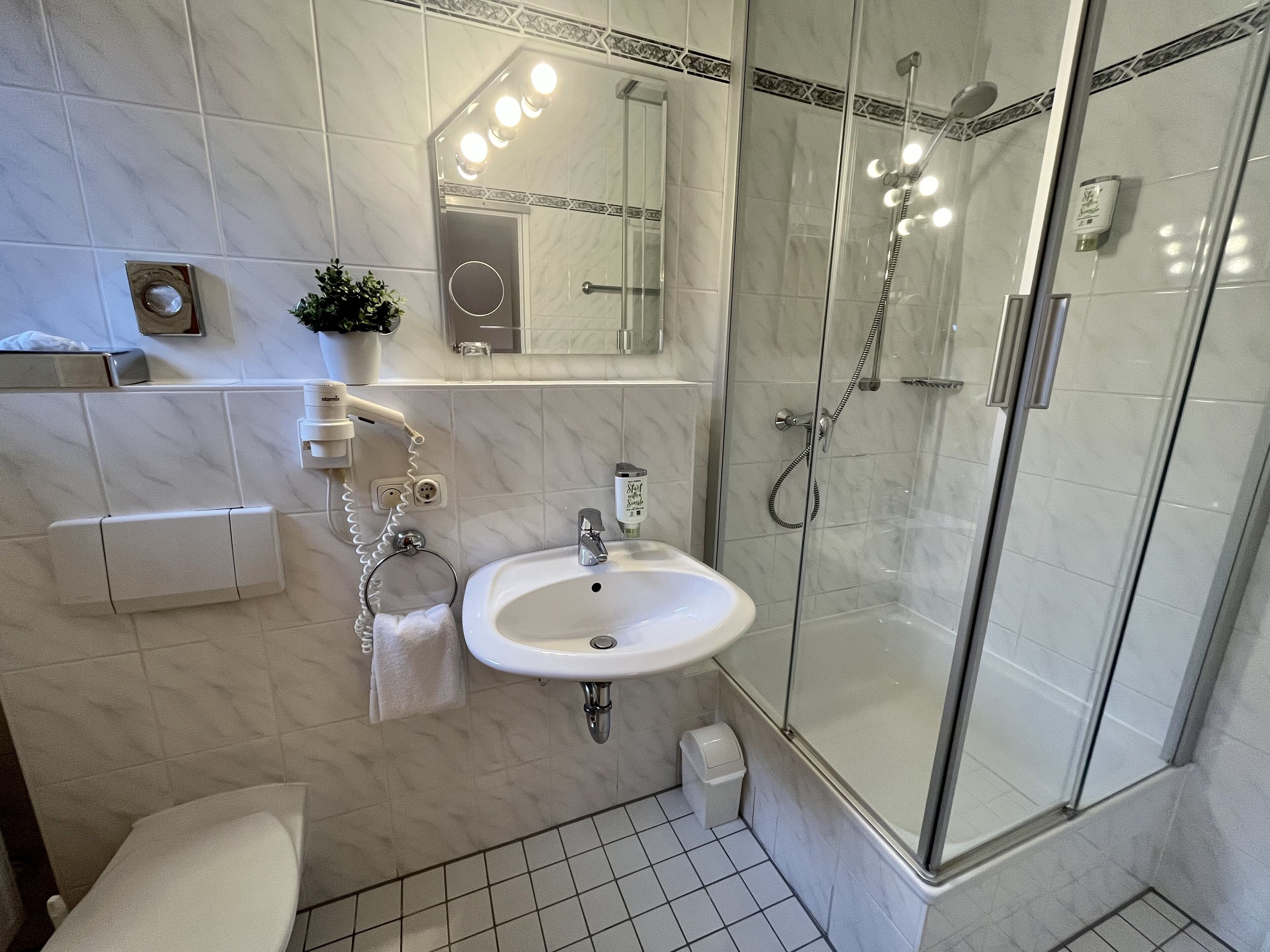 single room | bathroom | hair dryer, towels, soap, shampoo