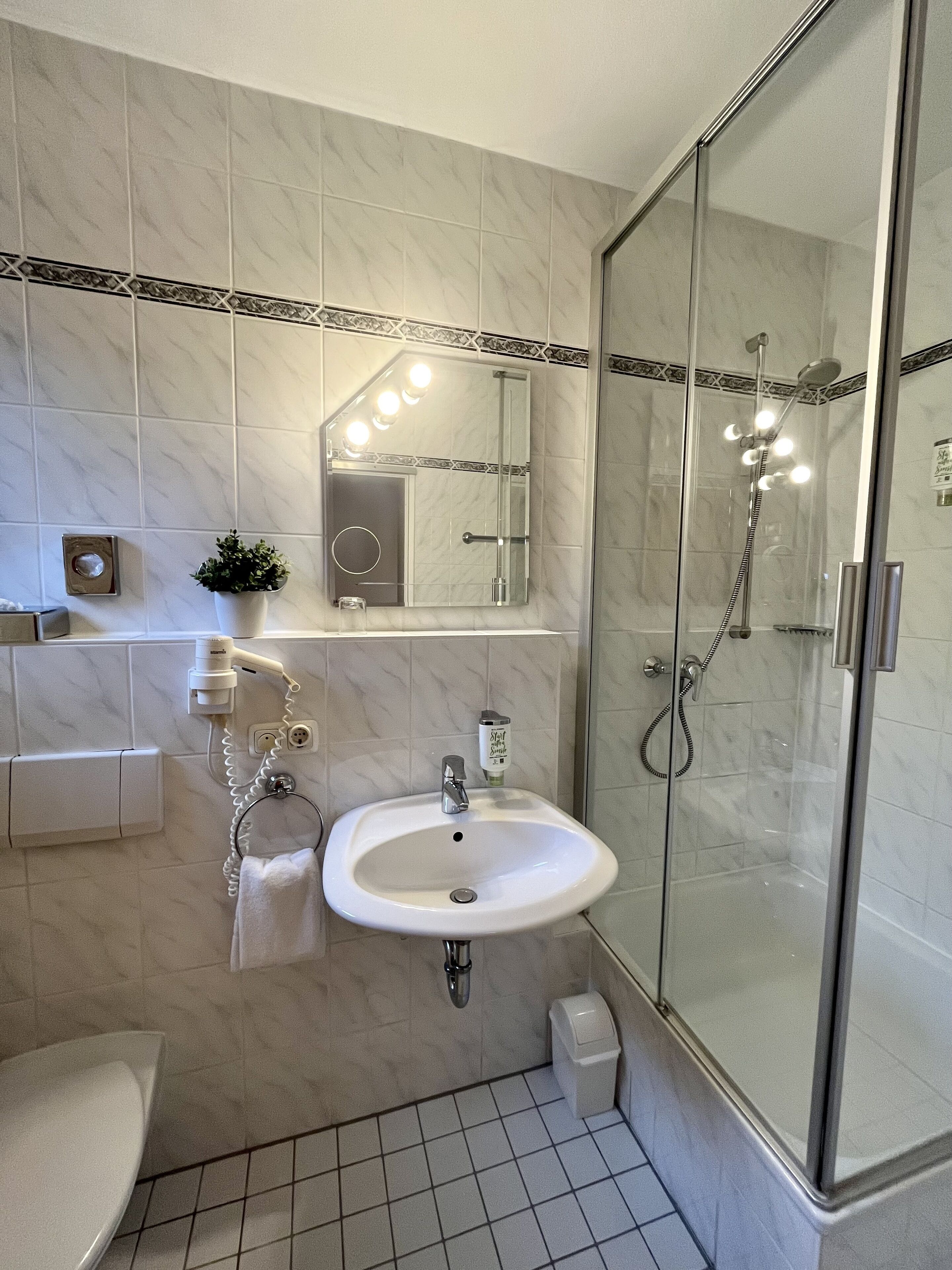 single room | bathroom | hair dryer, towels, soap, shampoo