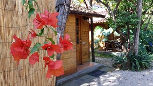 A wooden building with a door and steps leading to a porch. - Villaggio Verde (Sorrento)