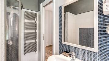 Shower, free toiletries, hair dryer, slippers