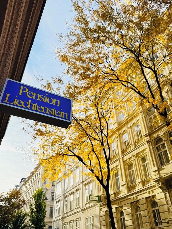 A street sign for Pension Liechtenstein with a classical building in the background. - Pension Liechtenstein (Vienna)