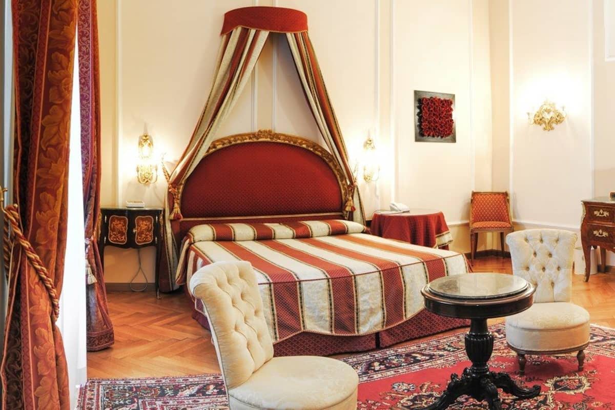 junior suite | minibar, in-room safe, desk, iron/ironing board