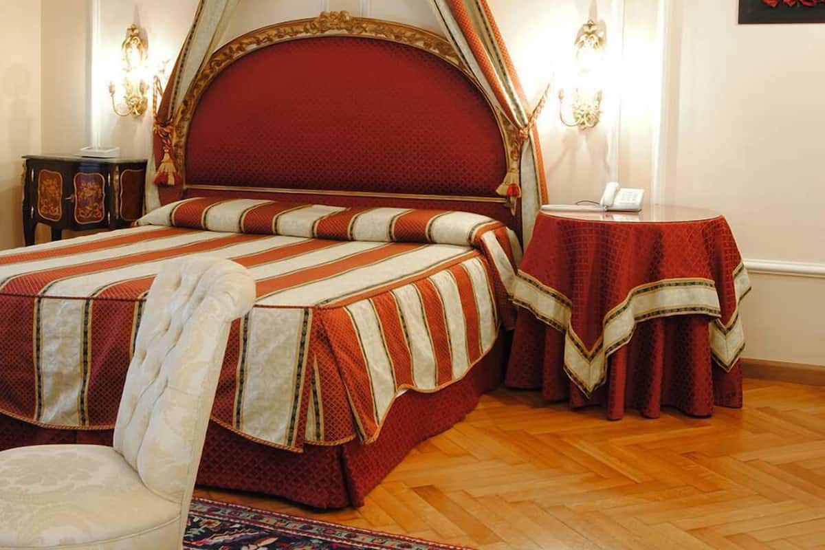 junior suite | minibar, in-room safe, desk, iron/ironing board