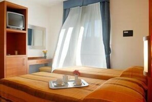 Quadruple Room | Minibar, in-room safe, desk, free WiFi