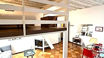 Loft | Living area | 50-inch Smart TV with satellite channels, TV, books