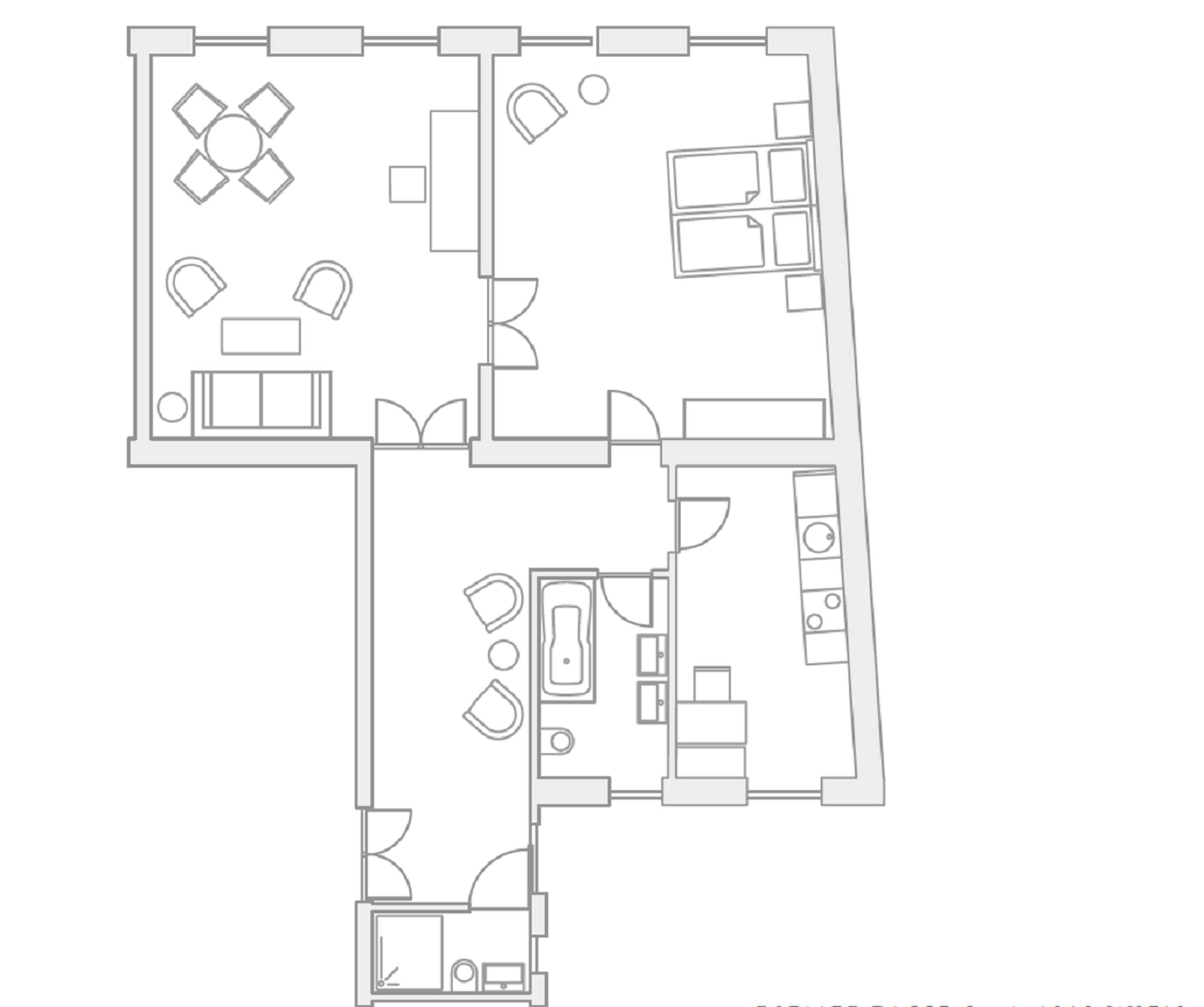 En planritning över ett hotell med flera rum, ett kök och en matplats.