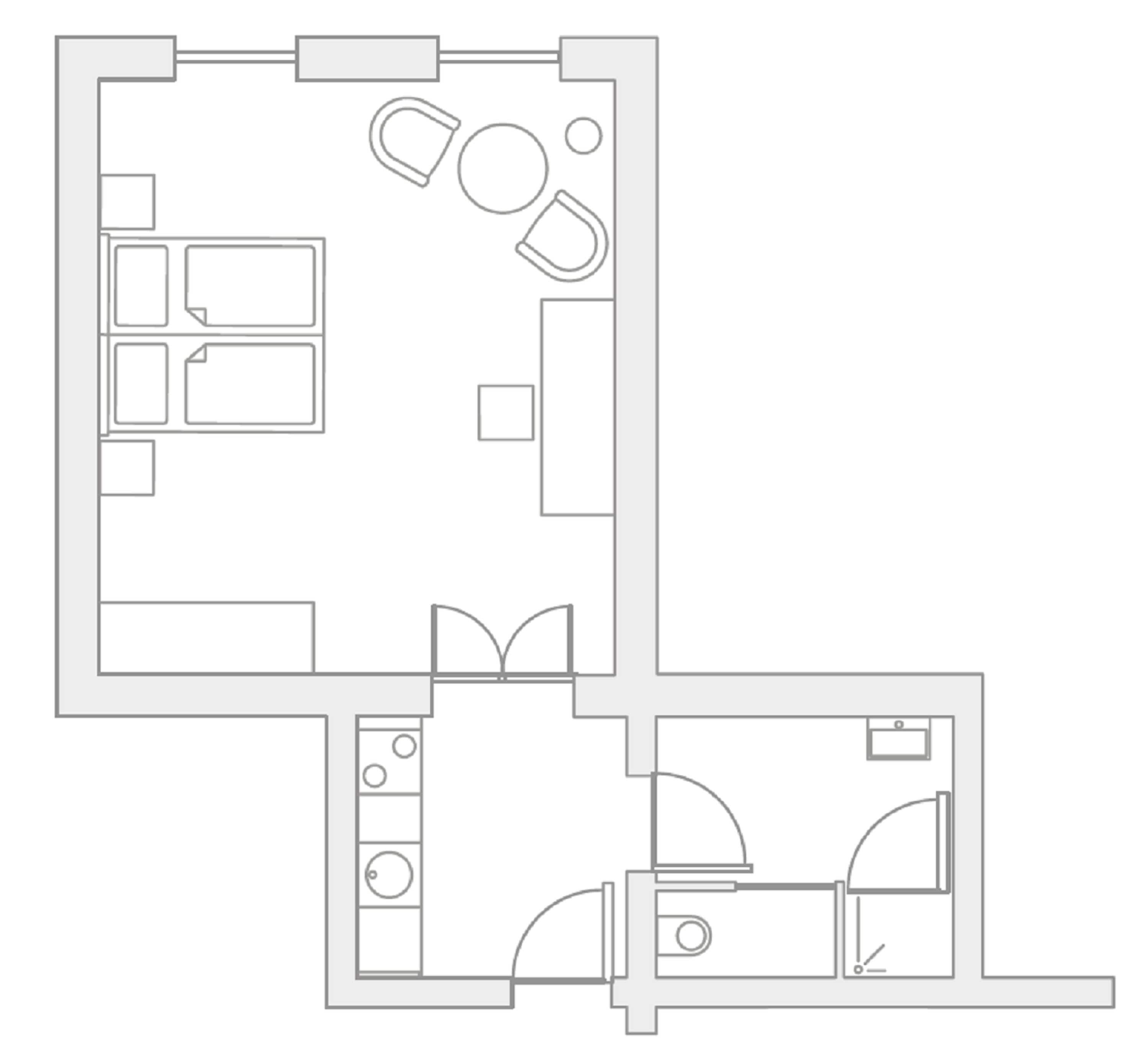 Een plattegrond met een keuken, een eethoek en twee slaapkamers.
