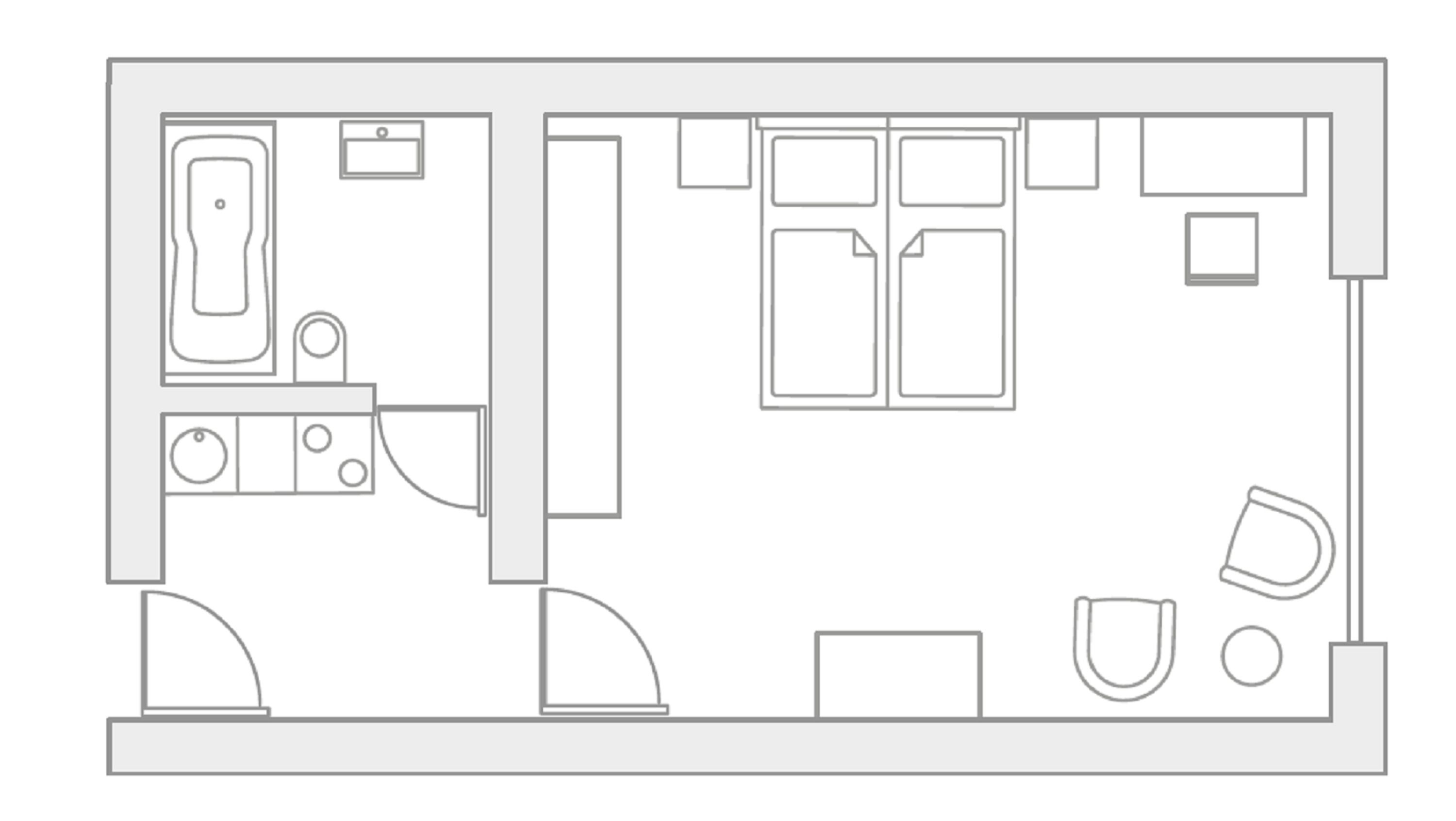A floor plan of a hotel room with a kitchenette, a bathroom, a seating area, and a small table.