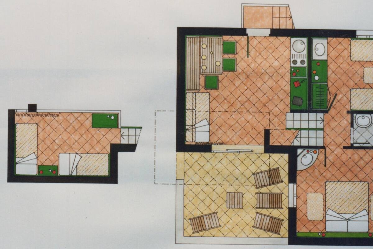 A floor plan of a hotel with a kitchen, dining area, and a separate living room area.