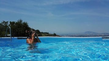 Seasonal outdoor pool, pool umbrellas, sun loungers