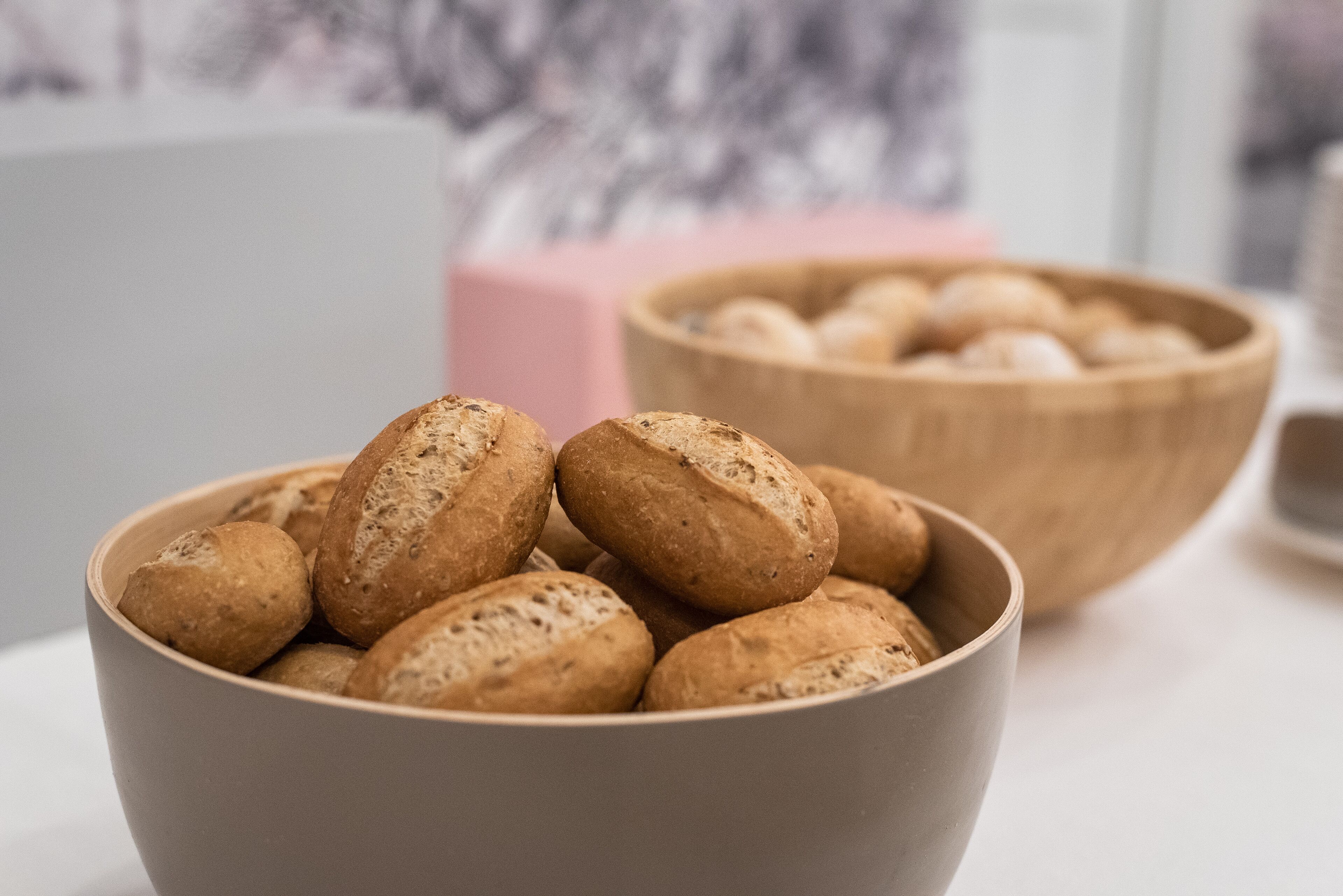 A bowl of bread on a table.