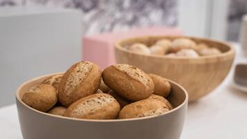 A bowl of bread on a table.