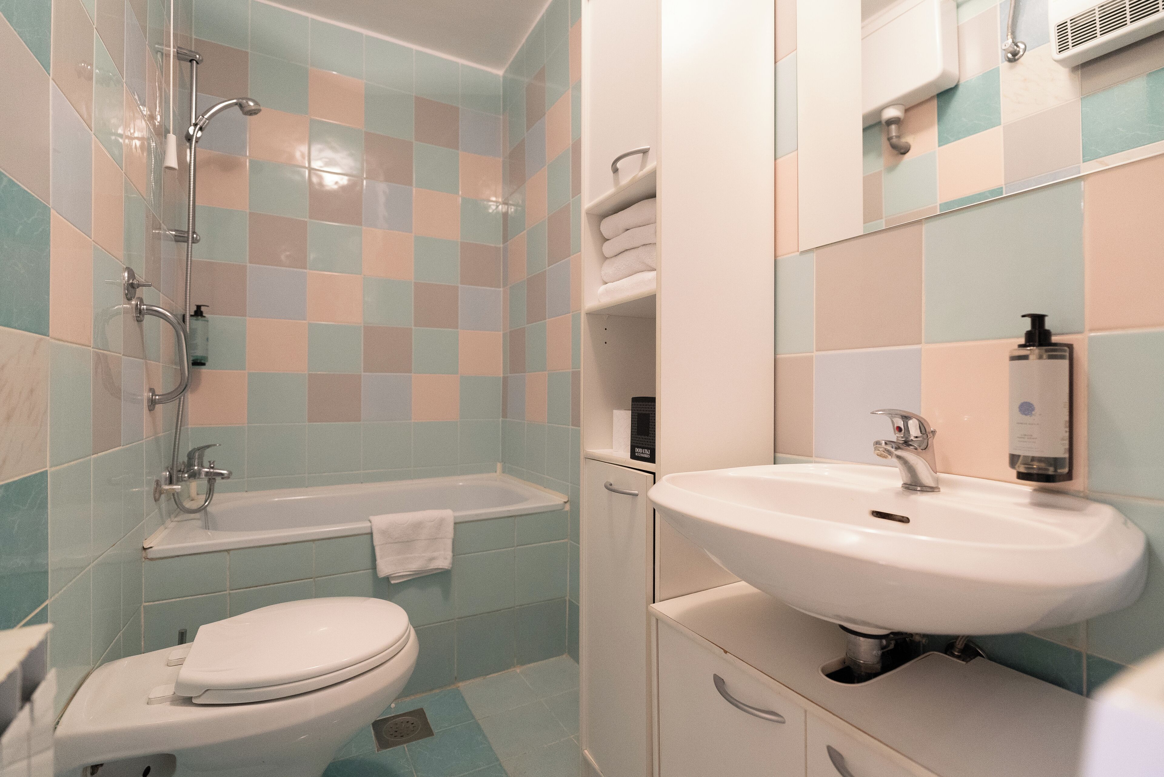standard apartment, city view | bathroom | combined shower/bathtub, designer toiletries, hair dryer, slippers