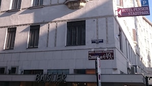 A hotel with a classic architectural style, featuring a prominent corner balcony and multiple windows. - Hotel Pension Stadtpark (Vienna)